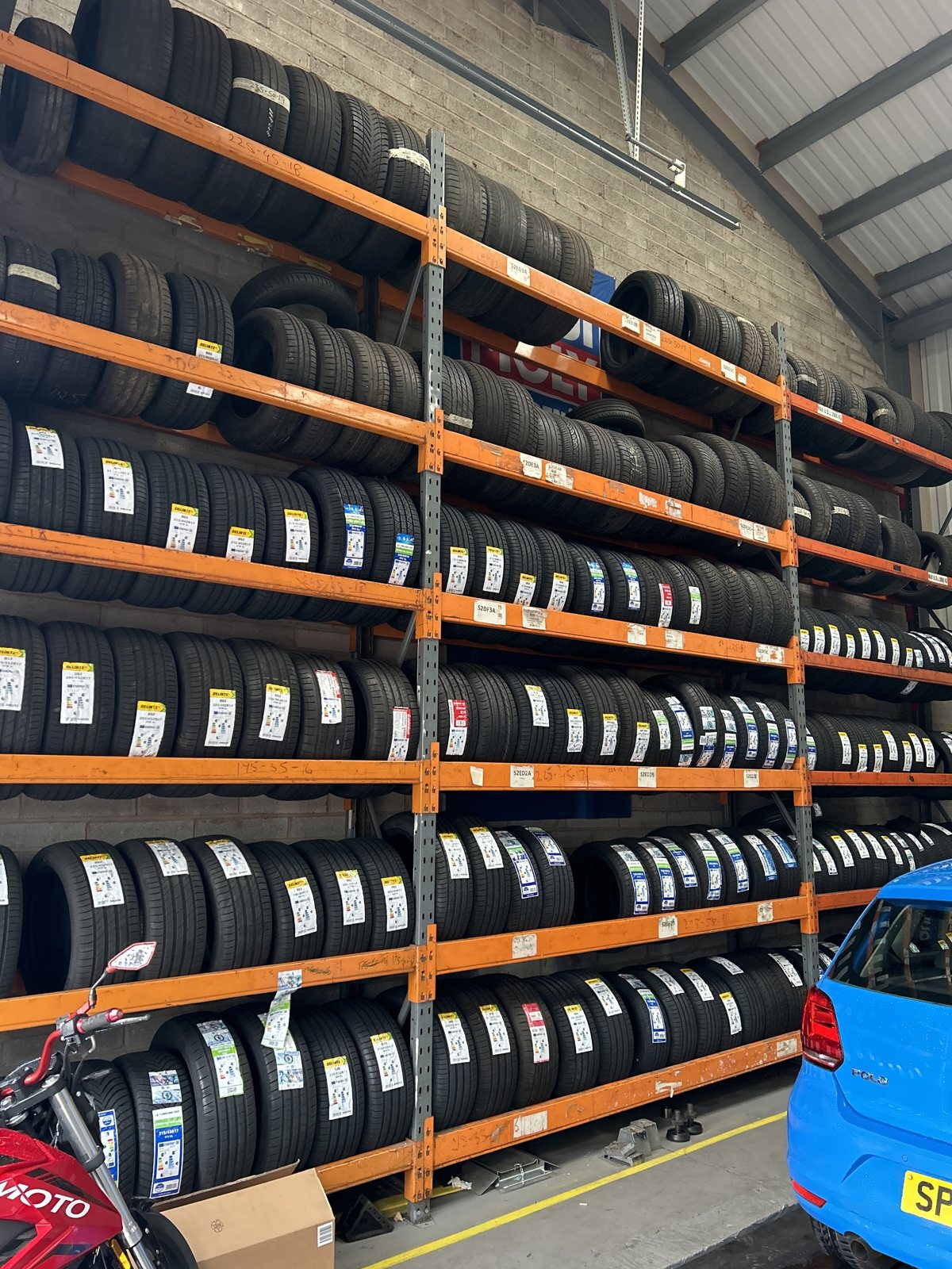 Close view of the tyre racking, with labelled tyres on every level